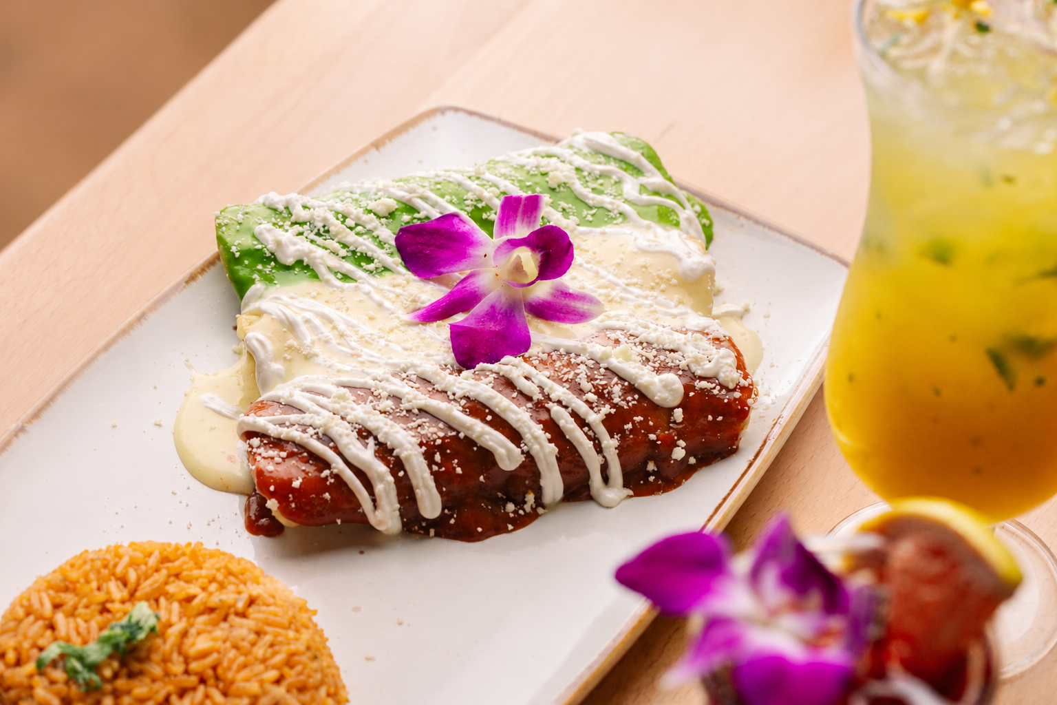 Bandera Enchiladas with drink and garnish