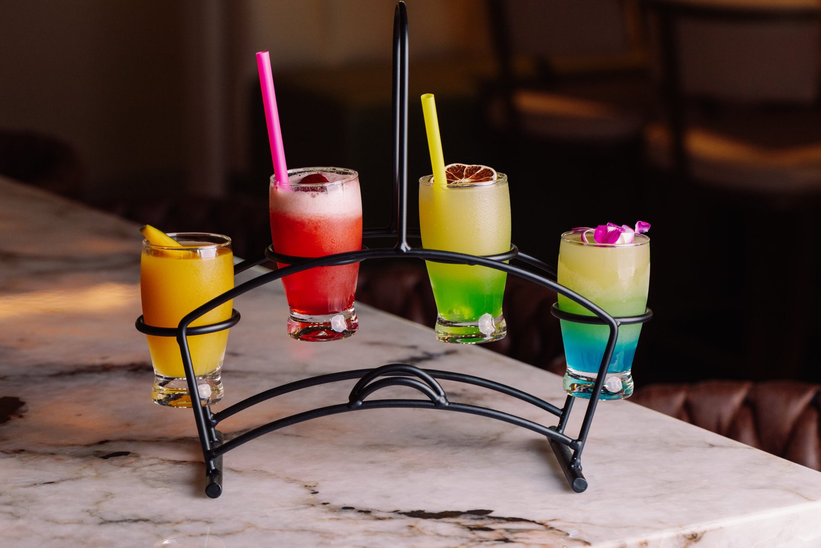Colorful vibrant bar drinks on an arched stand