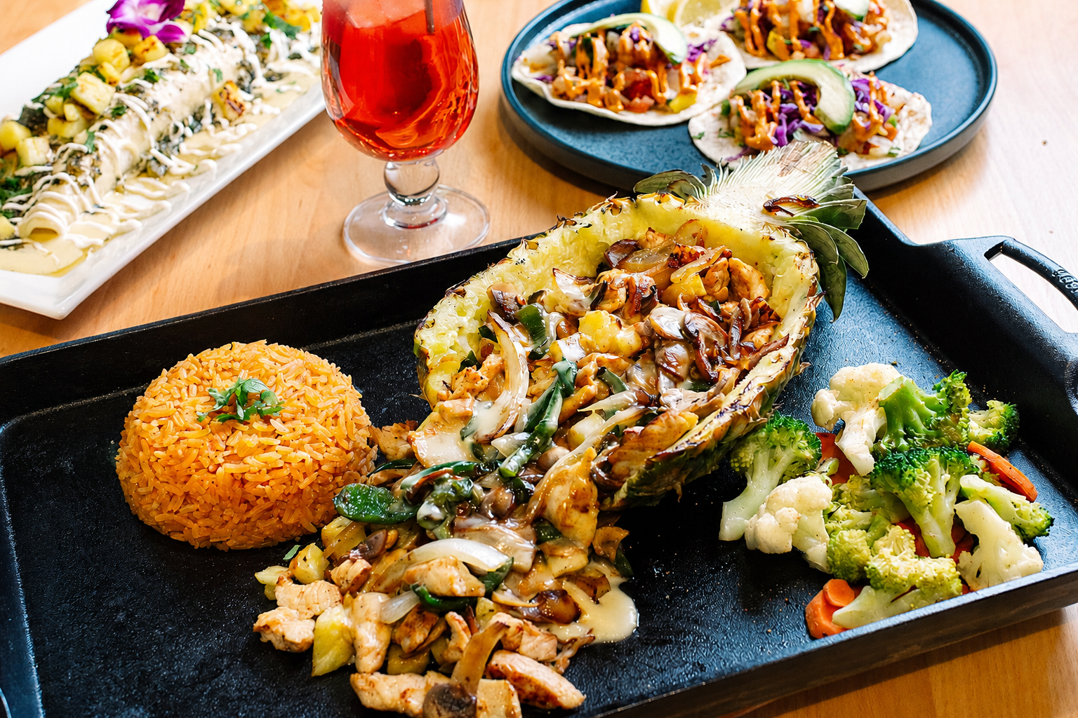 Sizzling pineapple boat with Mexican sides